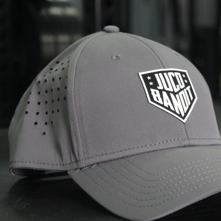 Eric Sim King of Juco Bandit grey performance hat front angle 2