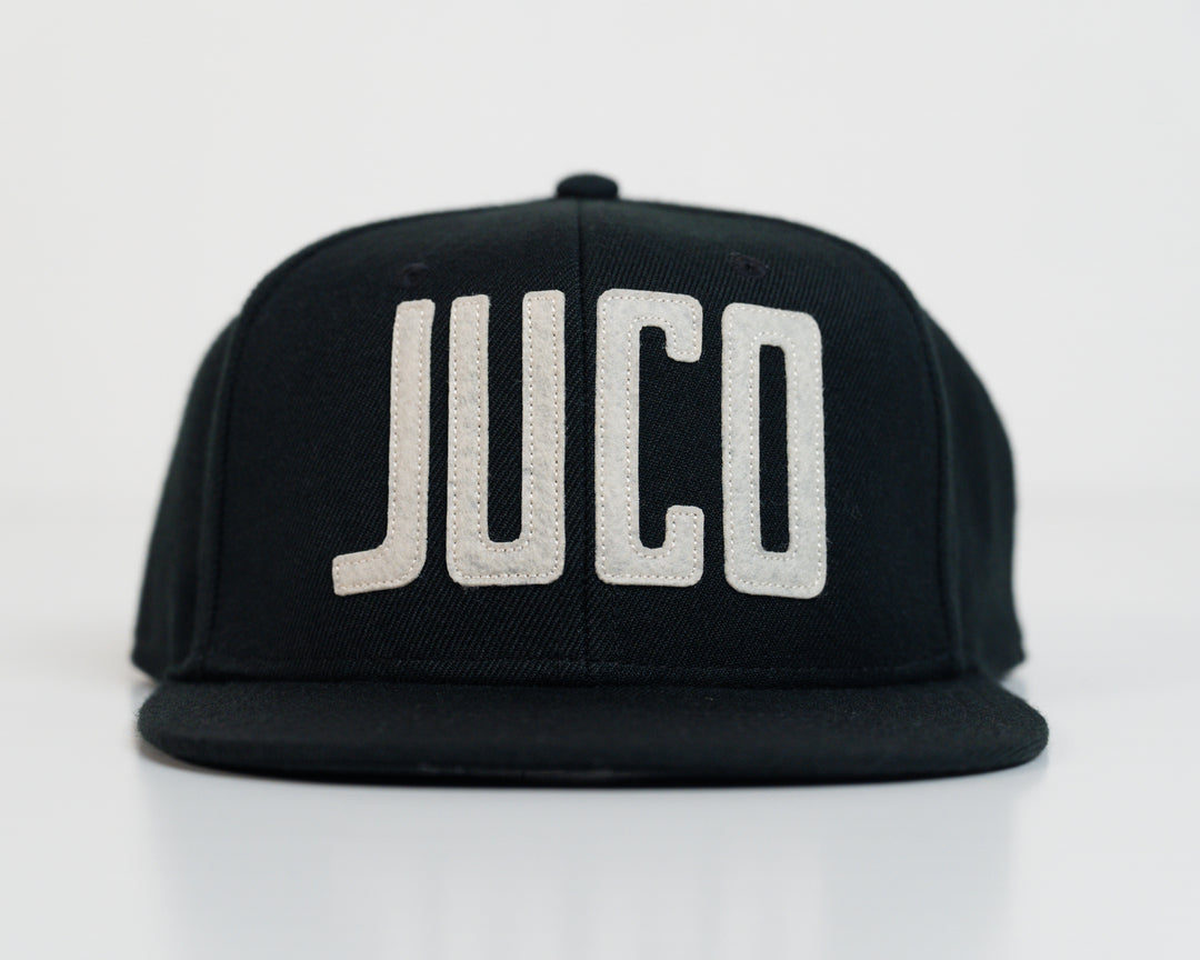 Eric Sim King of Juco Snapback hat black front 1