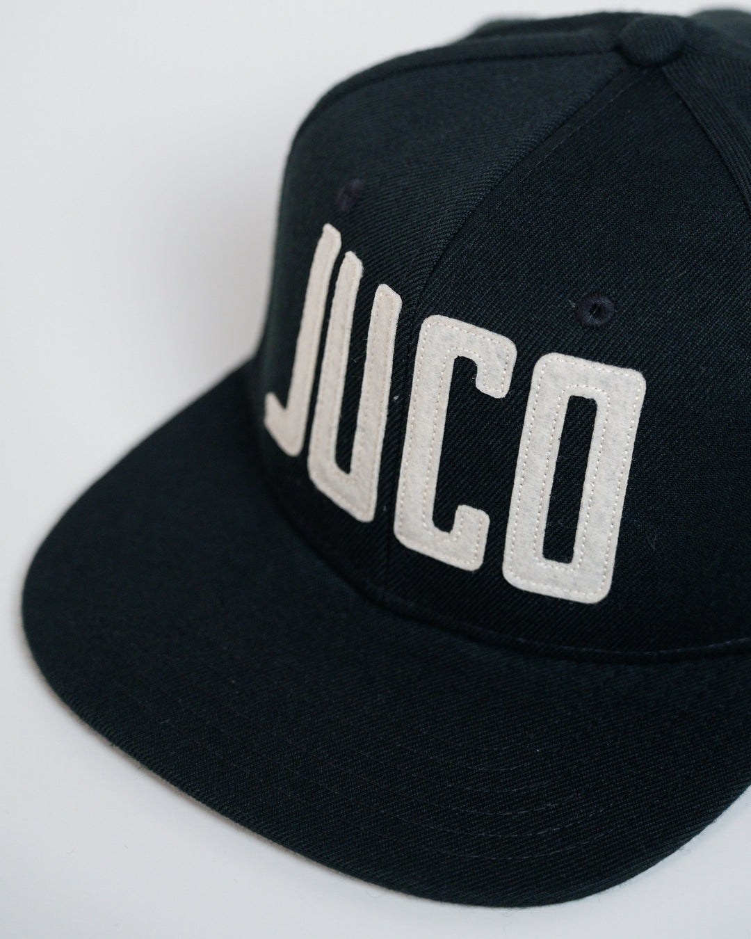 Eric Sim King of Juco Snapback hat black front angle